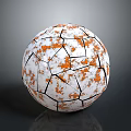 White And Orange Soccer Ball With Cracked Black Lines And Textured Surface