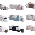 Massage Beds with Diverse Colored Sheets and Matching Stools for Spa Environments
