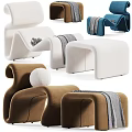 Modern Curved Lounge Chairs In White Brown Blue With Throw Blankets And Ottoman