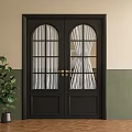 Black Double Doors With Arched Gridded Glass Panels Brass Handles Green Plant Beige Green Walls