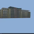 Modern Multi Story School Building With Yellow And Pink Exterior And Sloped Roof