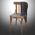 Vintage Wooden Leisure Chair With Plaid Blanket Draped Over Backrest