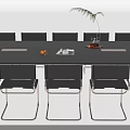 Modern Black Conference Table With Chairs Potted Plant And Orange Fruit