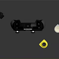 Black Game Controller With Display And Small Accessories Including Yellow White Components