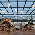 Aerial View of Modern Indoor Space With Glass Roof Hanging Cloud Decorations and Wooden Furniture