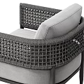 Modern Gray Lounge Chair With Woven Armrests And Black Metal Frame