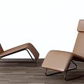 Modern Brown Leather Lounge Chair With Black Metal Frame On Wooden Floor