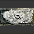 Natural Rock Formation With White Crystal Stone And Mossy Gravel Base