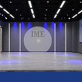 IME Modern Fitness Studio With Blue Lighting Gray Walls And Wooden Floor