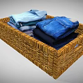 Wicker Home Organization Basket With Neatly Folded Shirts Jeans And Clothes