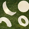 Decorative Outdoor Lights With Crescent Round Semicircular And Circular Ring Shapes On Grass