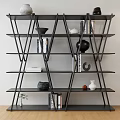 Modern Geometric Black Bookshelf With Multiple Shelves Holding Books And Decorative Vases