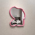 Pink Frame Cartoon Shaped Mirror Reflecting Bedroom Interior With Bed And Nightstand