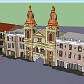 Hotel Building with Twin Orange Spires Classical Style Arched Entrance Adjacent Red Roof Buildings