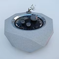 Modern Kitchen Electric Teapot On Gray Octagonal Stone Platform With Teacups And Small Plant