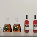 Elegant Wine Bottles And Glasses Displayed On White Table With Unique Designs