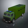 Green Military Truck With Large Cargo Body And Blue Emergency Lights On Roof