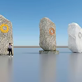 Three Stone Sculptures With Circular Carved Designs And People Beside Under Blue Sky