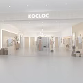 Modern Clothing Store Open Space With White Sofa Round Coffee Table And Hanging Clothes