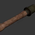 Vintage Military Weapon Featuring Cylindrical Metal Top And Wooden Handle Design