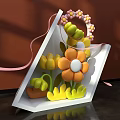Decorative Floral Display in White Triangular Box with Colorful Flowers Pink Ribbons and Flower Handle
