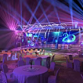 Modern Event Stage With Purple Blue Lighting Large Screen 20 Logo Round Tables And Chairs