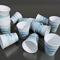 Blue And White Paper Cups With Wave Patterns Stacked And Scattered On Gray Surface 3d model