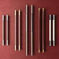 Door Handles of Various Materials and Different Colors Arranged on Red Background