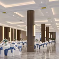 Spacious Banquet Hall Featuring White Tablecloths Blue Ribbons And Flower Centerpieces