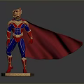 Man in Superhero Costume with Red Cape Blue Bodysuit and Golden Accents Standing on Base