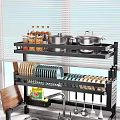 Organized Kitchen Shelf With Jars Pots Colorful Plates And Cooking Utensils