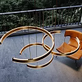 Contemporary Ring Design Chandelier with Warm Lighting and Lush Forest View in Interior