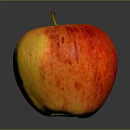 Fresh Red And Yellow Striped Apple On Dark Background With Shiny Surface