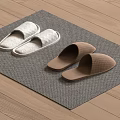 White and Brown Slippers Placed on Gray Mat Over Wooden Floor