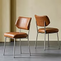 Modern Brown Leather Dining Chairs With Curved Backrest And Metal Frame