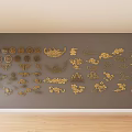 Golden Carvings in Various Shapes on Gray Wall with Wooden Floor