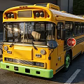 Bright Yellow School Bus With Stop Sign Green Wheels On City Street