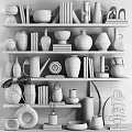Modern Ceramic Vessels And Decorative Pieces On Shelves With Books And Various Styles