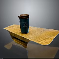 Green Coffee Cup With Brown Lid On Wooden Table Surface