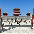 Ancient Chinese Architecture Tower Gate With Red Pillars Stone Pavement And Crowd Walking