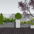 White Planter Boxes On Wooden Deck With Green Plants Shrubs And White Fence