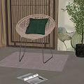 Rattan Leisure Chair with Green Cushion Metal Legs and Wicker Screen on Light Rug