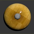 Yellow Wooden Pepper Grinder With Wood Grain And Metal Top Knob On Black Surface
