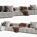 Light Gray Fabric Sectional Sofa With Multiple Plush Cushions And Warm Throw Blanket