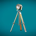 Vintage Metallic Tripod Mounted Searchlight With Reflector And Adjustable Legs On Teal Background