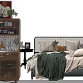 Cozy Double Bed With Plush Pillows Green Blanket Wooden Cabinet And Potted Plant Decor