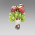 Artistic Fruit Vegetable Sculpture Featuring Strawberries Green Grapes And Red Eyes