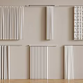 Various Style Curtains Display On Beige Wall With Metal Rods And Wooden Floor
