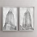 Two Framed Black And White Sketch Style Landscape Paintings With Tall Buildings