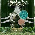 Outdoor Wedding Decor Setup With Green Backdrop White Flowers Circular Elements And Golden Chairs